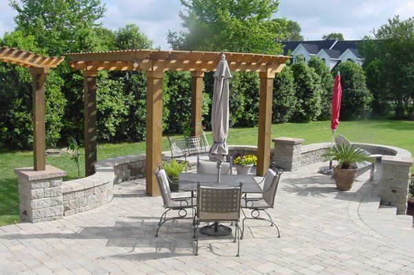 Outdoor Seating Area With Closed Umbrella — Virginia Beach, VA — Gentle Rain