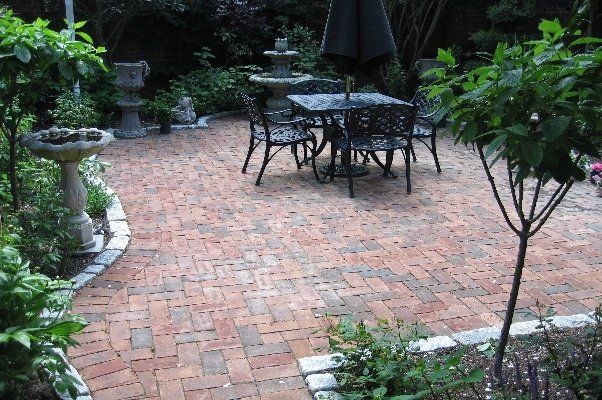 Black Metal Seats And Chairs On Nice Hardscaped Land — Virginia Beach, VA — Gentle Rain