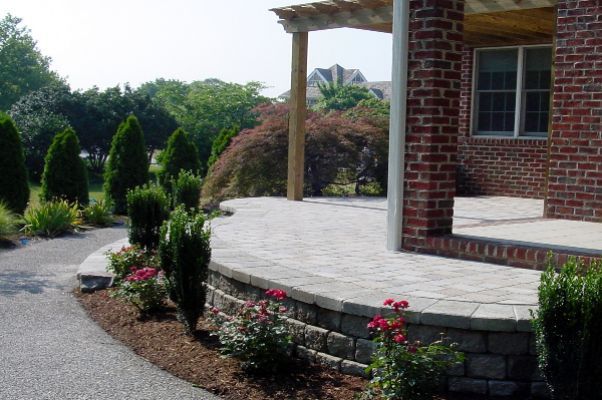 Elevated Stone Area Next To Garden With Nice Hardscaped Land — Virginia Beach, VA — Gentle Rain