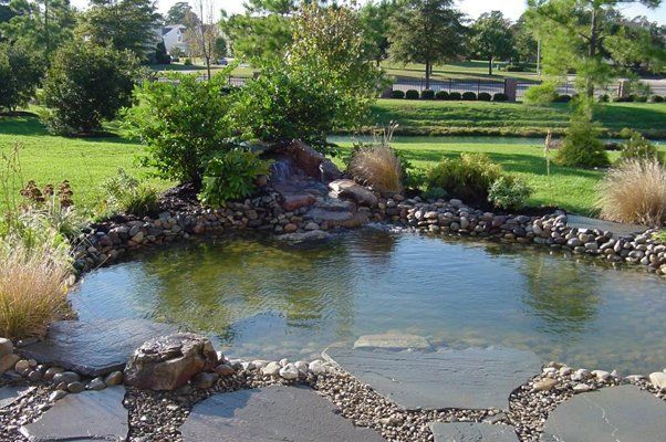 Large Water Feature Next To Lush Grass And Trees — Virginia Beach, VA — Gentle Rain