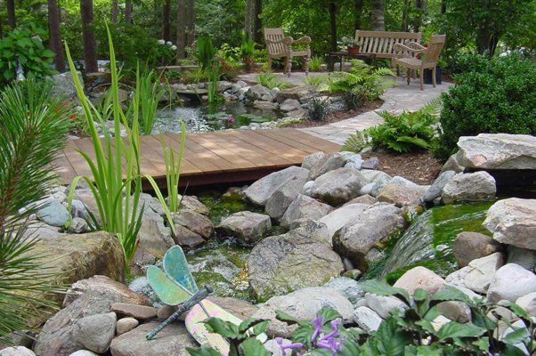 Wooden Bridge Next To Wooden Benches And Stones — Virginia Beach, VA — Gentle Rain