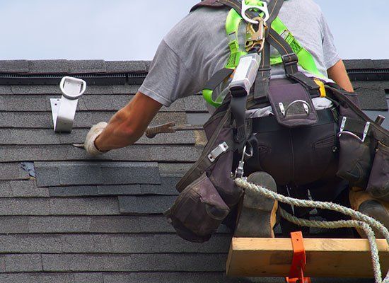 Man Installing Roof — Schenectady, NY — All Seasons Roofing Man Installing Roof — Schenectady, NY — All Seasons Roofing