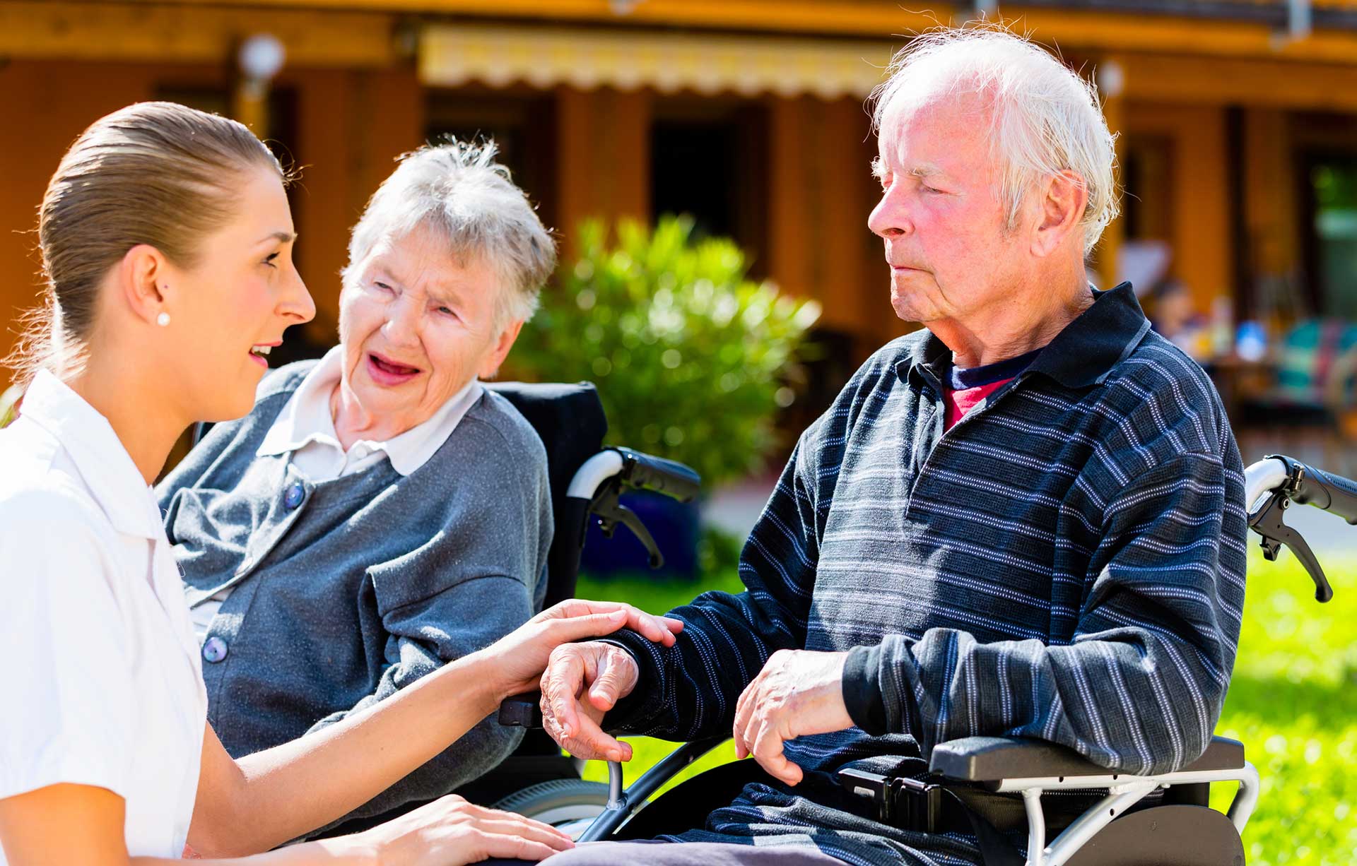 elderly couple in wheelchairs
