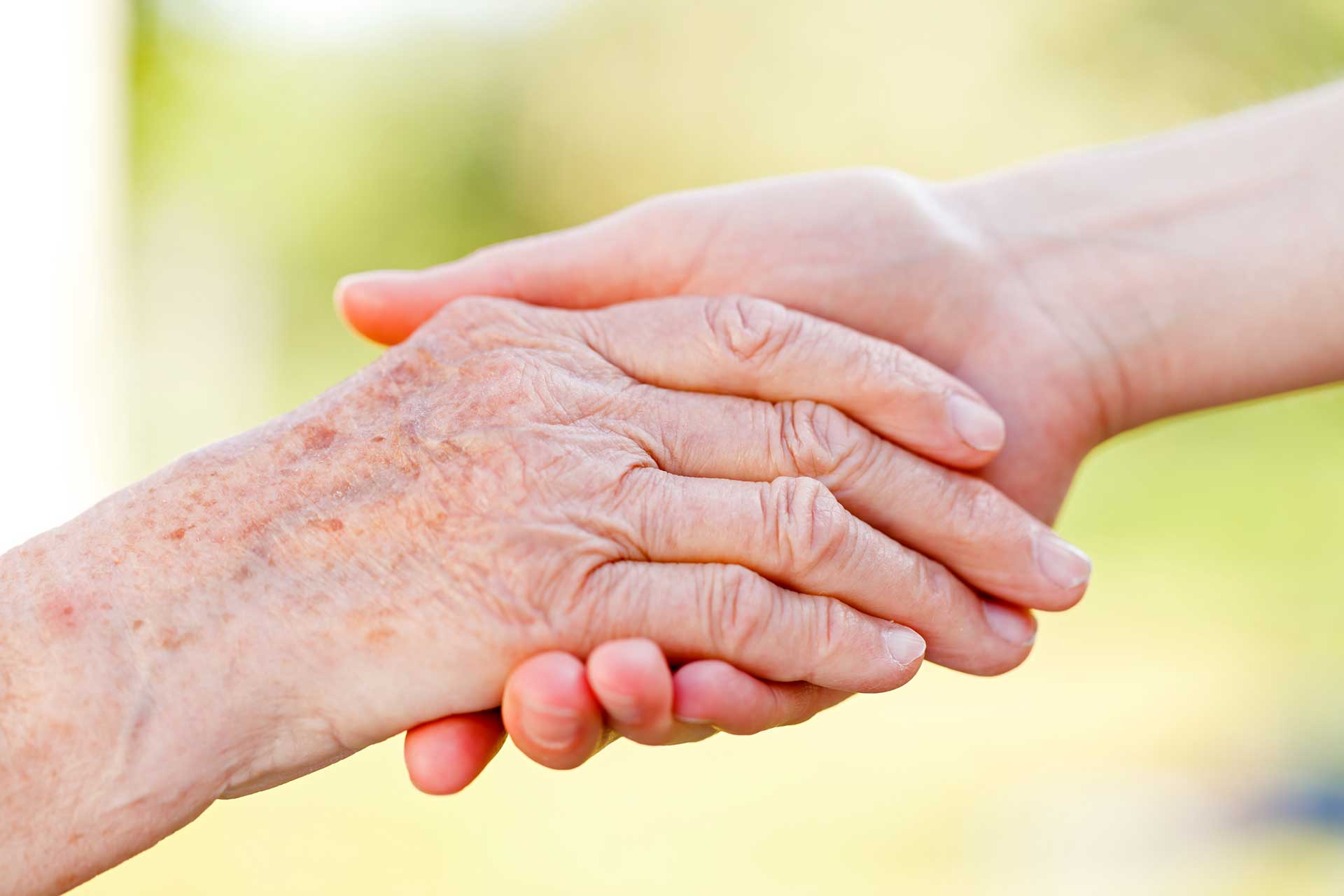 young and old handshake