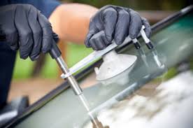 Man Changing Glass on Car — Hunstville, AL — A+ Glass Company LLC Man Changing Glass on Car — Hunstville, AL — A+ Glass Company LLC
