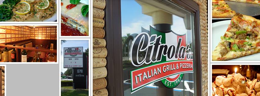 Citrola's Italian Grill & Bar sign in a window, surrounded by images of food and wine.