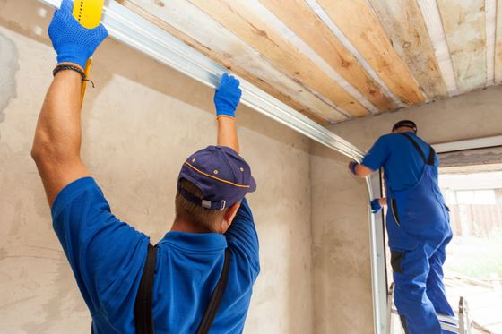 workers installing a garage door