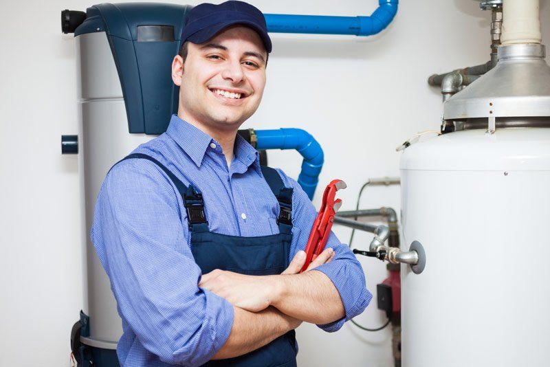 Plumber After Repairing Water Heater — Hopewell, PA — Mark A. Redinger Plumbing and Heating Inc. Plumber After Repairing Water Heater — Hopewell, PA — Mark A. Redinger Plumbing and Heating Inc.