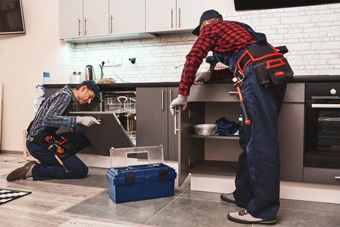 Plumber Man Fixing A Sink — Hopewell, PA — Mark A. Redinger Plumbing and Heating Inc. Plumber Man Fixing A Sink — Hopewell, PA — Mark A. Redinger Plumbing and Heating Inc.