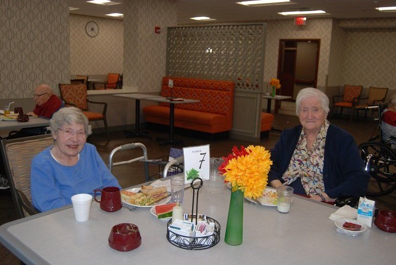 Residents enjoying lunch in the dining room. Residents enjoying lunch in the dining room.