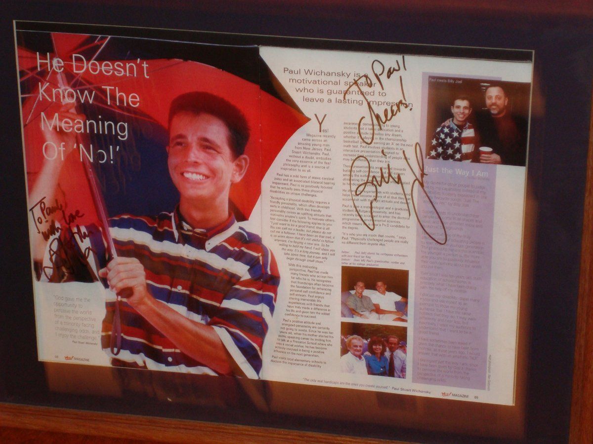 The magazine autographed by Billy Joel and Elton John