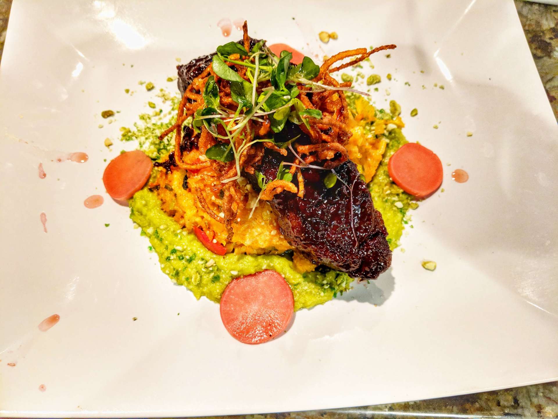A close up of a plate of food on a table