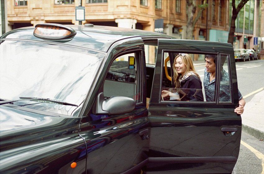 Couple taking taxi