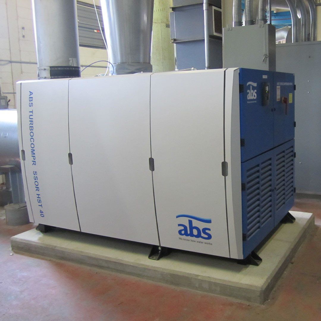 A large abs machine is sitting on a concrete platform
