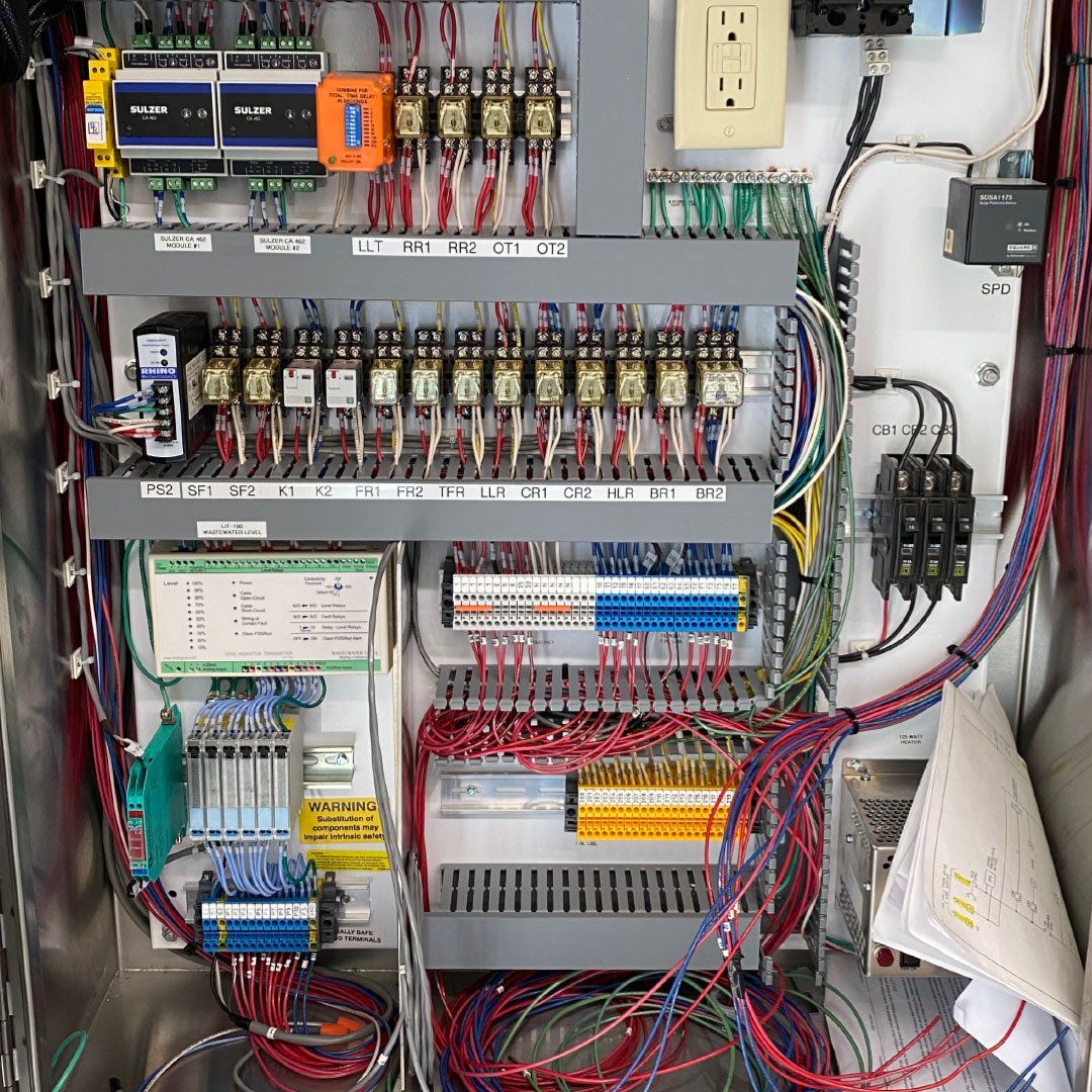 The inside of a electrical box with a lot of wires
