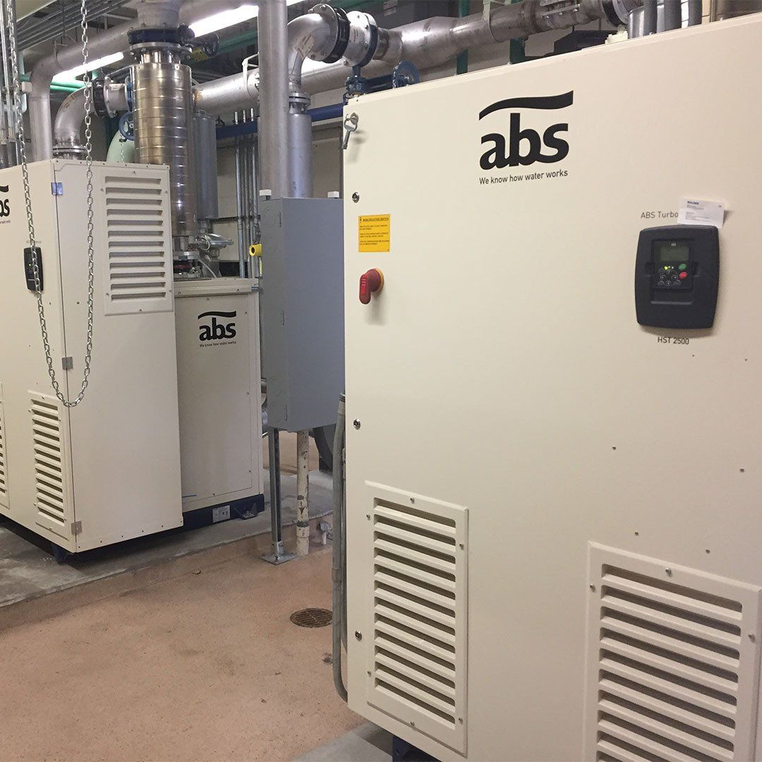 Two abs boxes are sitting next to each other in a room