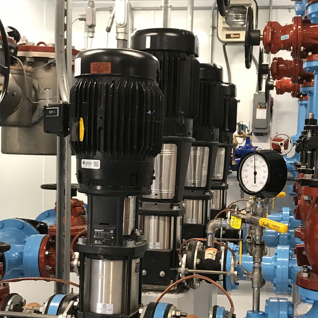 A room filled with lots of pipes and pumps