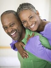Couple with bright white smiles — Dental Services in Cheyenne, WY Couple with bright white smiles — Dental Services in Cheyenne, WY