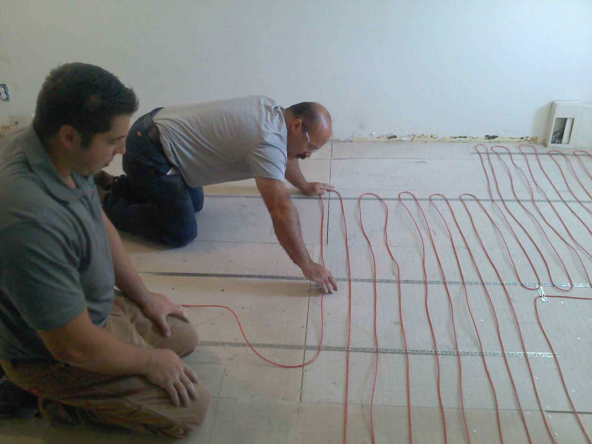 Man handling electric wire — New Construction in Beaver, PA