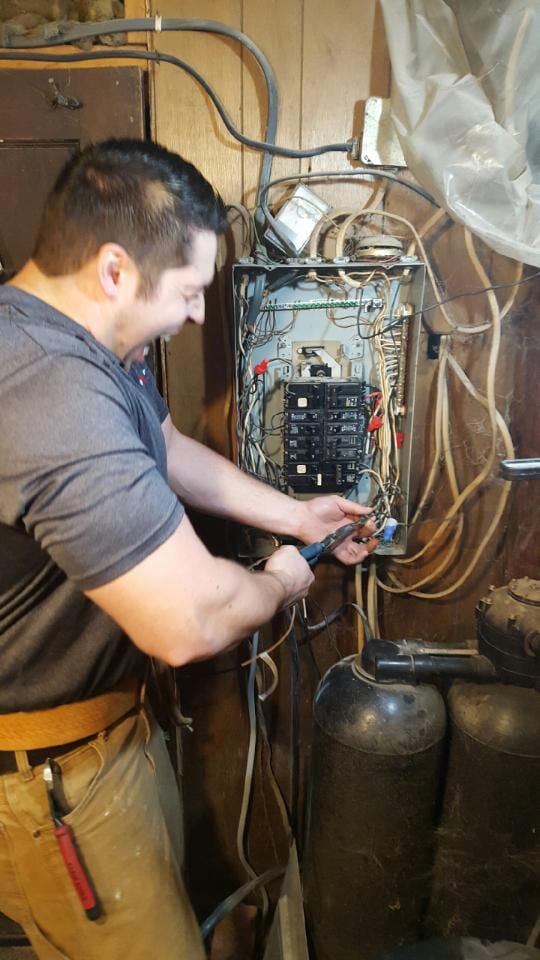 Man fixing wires 2 — New Construction in Beaver, PA