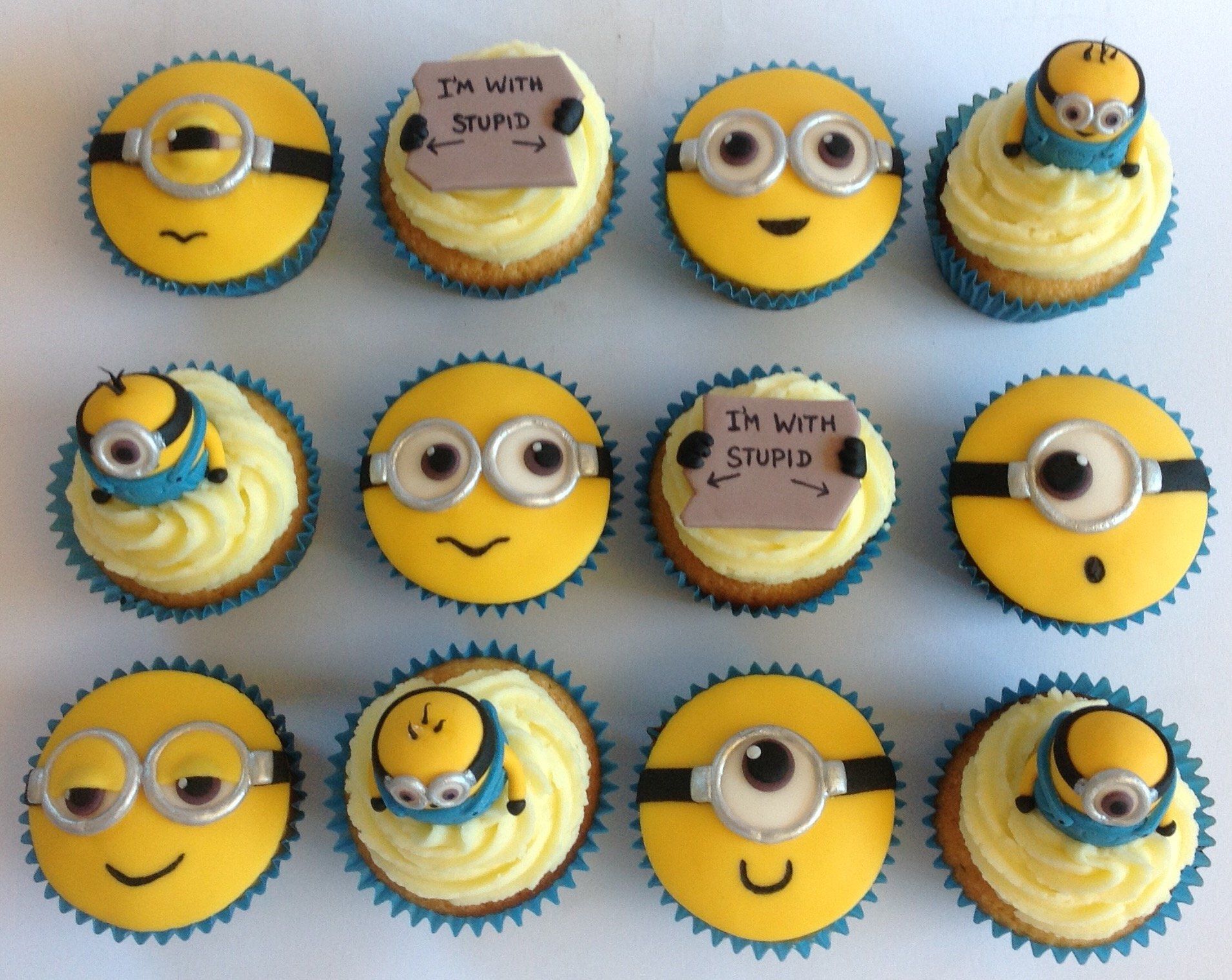 12 faces cupcakes with fondant created by A Cherry On Top, Isle of Wight.