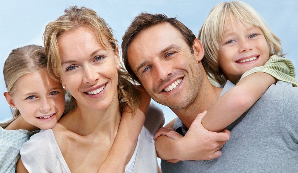 Family of Four Smiling
