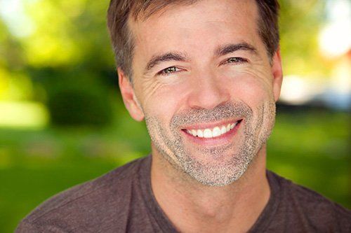 Dental Crowns middle age man smiling