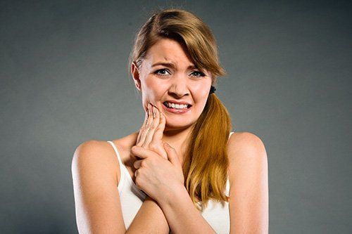 Periodontics (Gum Disease Care) Woman with Tooth Pain | Dentist Near Me Endicott
