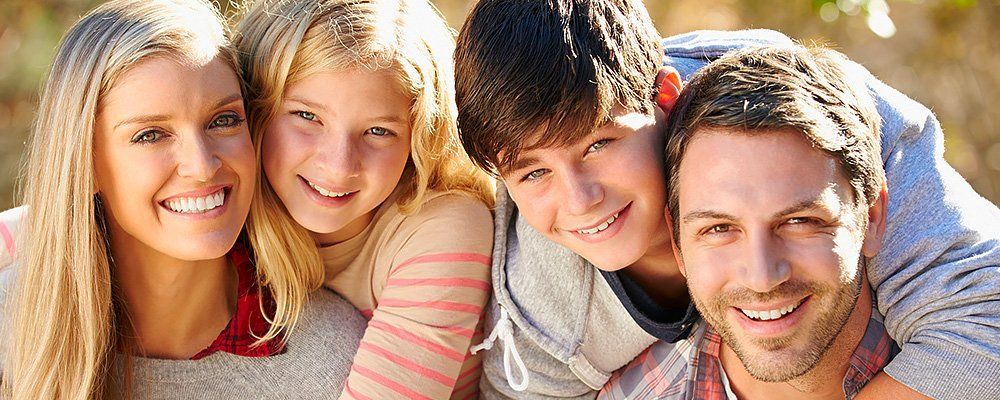 Family of Four Smiling