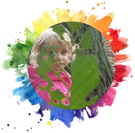 Kid using leaves to paint - Preschool in Beaverton, OR