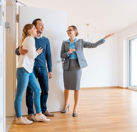 Realtor – Realtor Showing House to a Young Couple in Indianapolis, IN Realtor – Realtor Showing House to a Young Couple in Indianapolis, IN