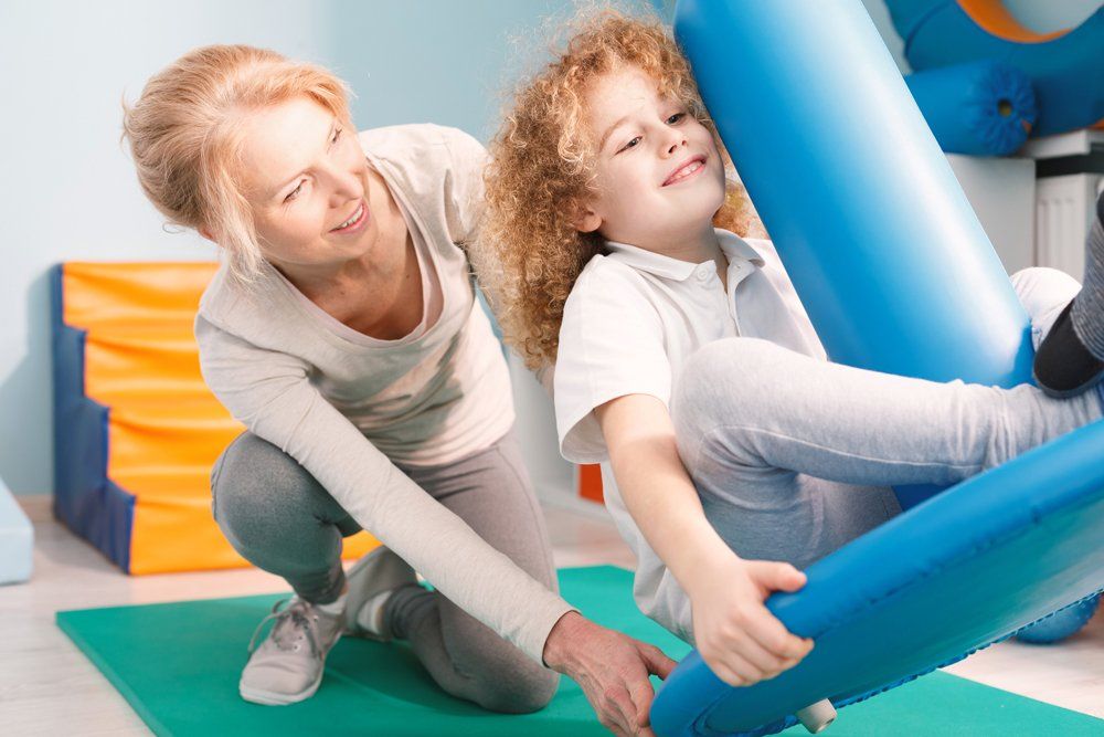Happy Child And A Doctor — Oakland, MD — Garrett Orthopedic Physical Therapy & Rehabilitation