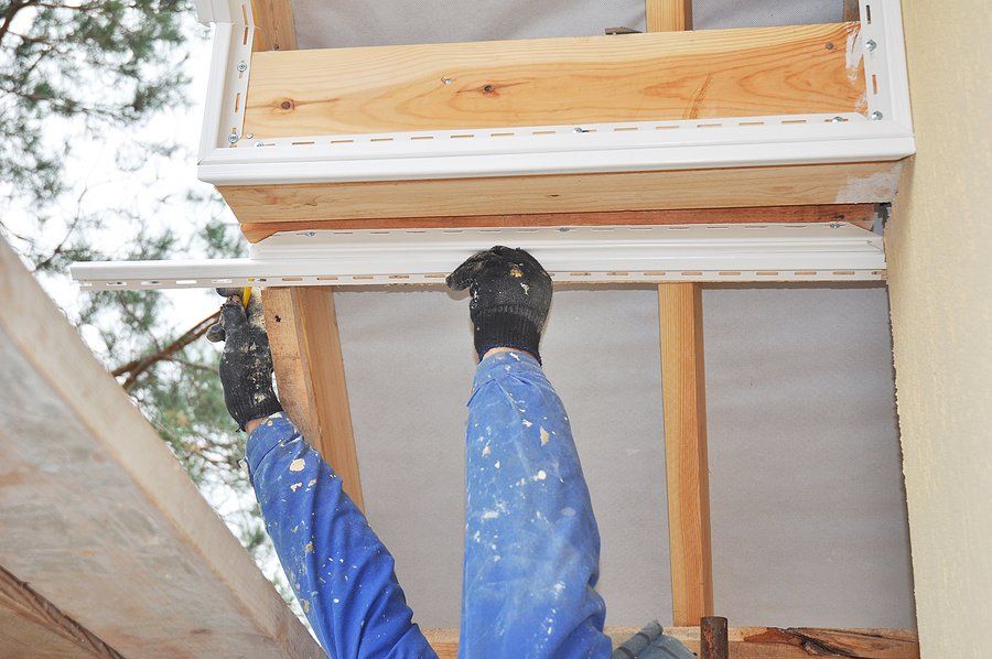 someone doing soffit repair