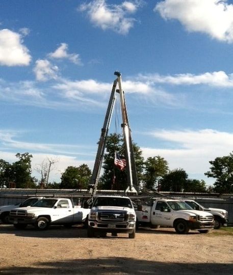 Parked Trucks — Houston, TX — Raymond Services Inc. Parked Trucks — Houston, TX — Raymond Services Inc.