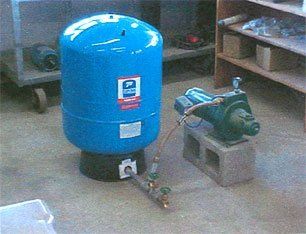 Tank Connected to a Pump — Houston, TX — Raymond Services Inc. Tank Connected to a Pump — Houston, TX — Raymond Services Inc.