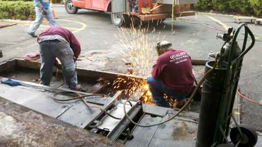 Welder working on warehouse Construction — Services in Piscataway, NJ Welder working on warehouse Construction — Services in Piscataway, NJ