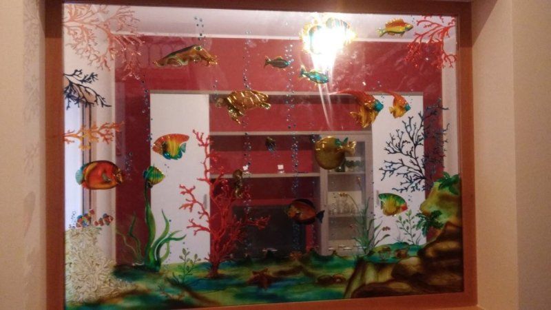 Specchio decorato con pesci