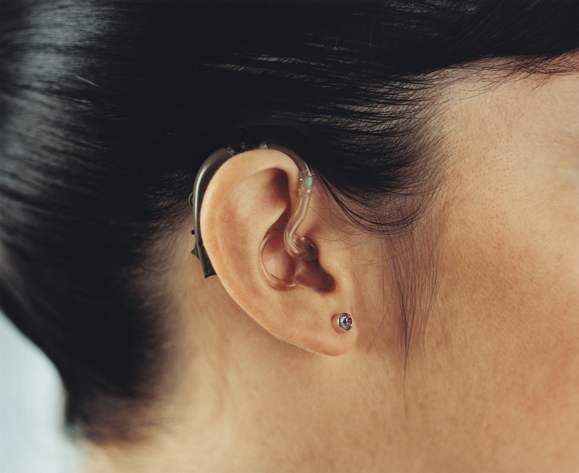 Hearing Aid — Doctor Installing the Hearing Aid Device in Pottstown, PA