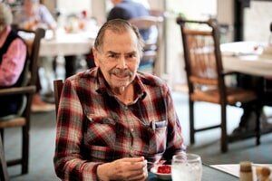 old man enjoying  time at  Timberhill Villa