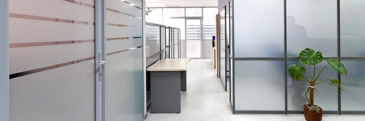 Picture of an office hallway with frosted glass doors and windows