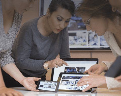 people using electronic devices during a meeting