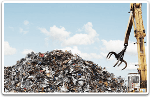 Grabber crane about to pick up scrap metal from a large pile
