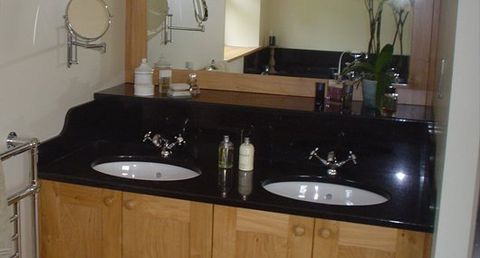 Black granite vanity unit with polished sink and upstand Black granite vanity unit with polished sink and upstand