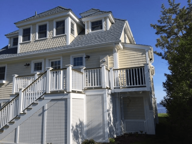 Side view of large white house with car — Deep River, CT — Zdon Builders, Inc.