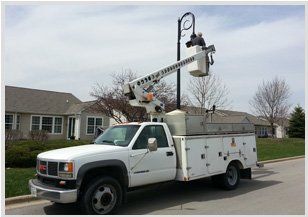 Electrician Repairing Electric Plug Outlet — Electrical Services in Wilmington, IL Electrician Repairing Electric Plug Outlet — Electrical Services in Wilmington, IL