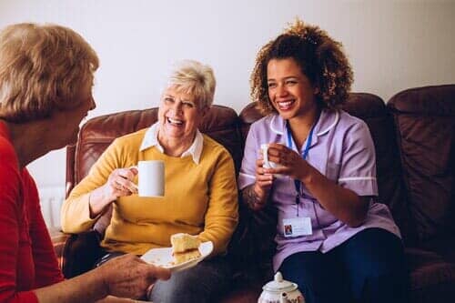 Caregiver Sharing Tea Time - Retirement Home in San Ramon, CA