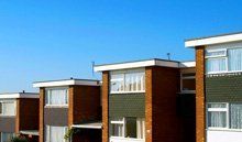 Flat roofing products available in Bilston in the West Midlands A row of buildings with flat roofs