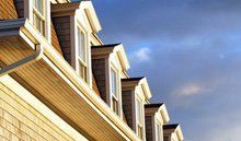 Roof windows & skylights available in Bilston in the West Midlands A row of homes with roof windows