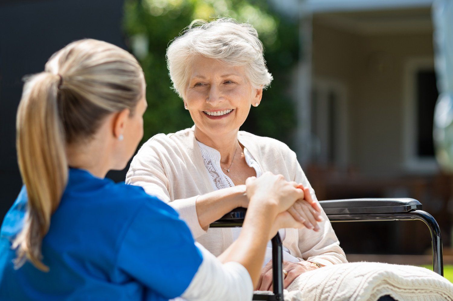 Senior On Wheelchair Talking To A Lady — Fruitland Park, FL — Tri-County Caregiver Resource Center Senior On Wheelchair Talking To A Lady — Fruitland Park, FL — Tri-County Caregiver Resource Center