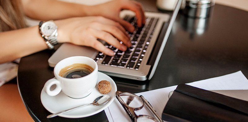 Coffee at computer with Quickbooks